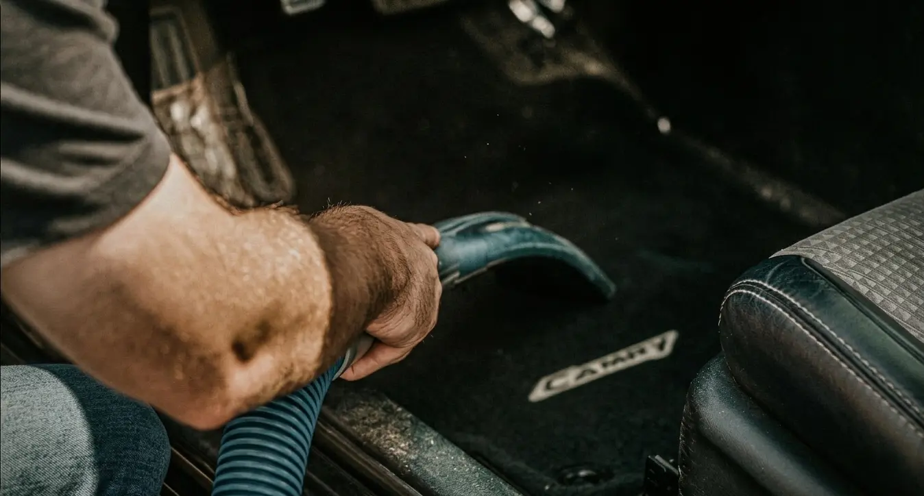 Car interior vacuum — seats, carpets and crevices cleared before wet cleaning